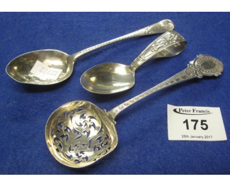 Pierced silver sifter spoon, an engraved silver teaspoon and a silver caddy spoon. (3)