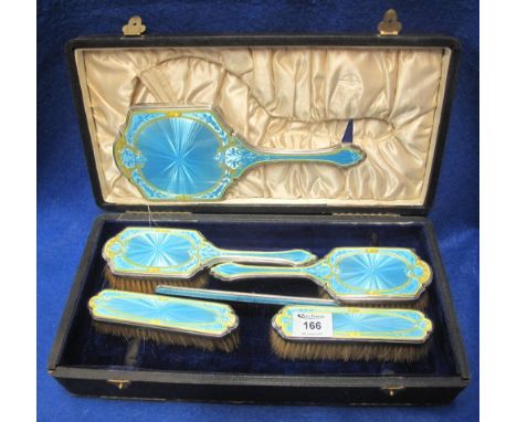 Silver and pale blue guilloche enamelled, gilt highlighted lady's dressing table set comprising two pairs of brushes, comb an