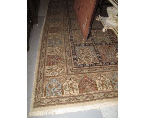 Large Persian design carpet on a beige ground with floral, foliate, figural and animal panels. CONDITION REPORT: Used but no 