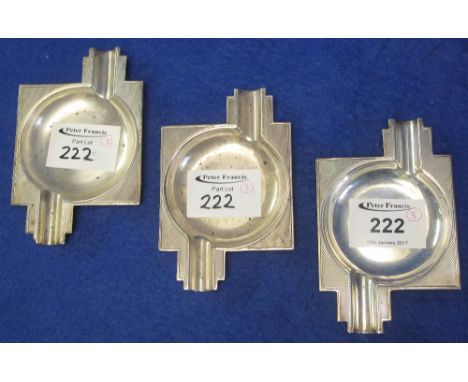 Three matching engine turned silver Art Deco design ashtrays.