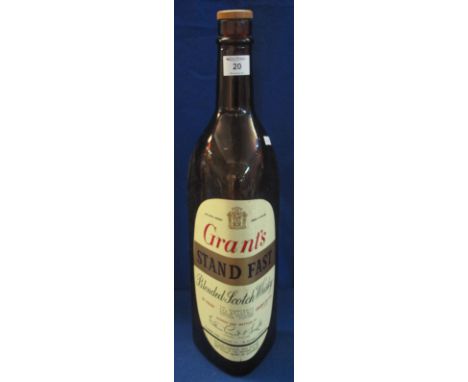 Empty 133.33 fluid ozs (1 US gallon) large bottle Grant's 'Standfast' blended Scotch whisky.