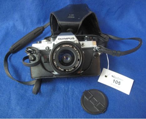 Olympus OM10 35mm SLR camera with 28mm lens in leather Eveready case.