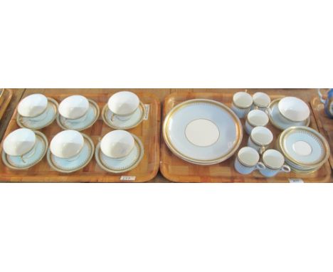 19th Century porcelain teaware on a duck egg blue ground with gilt decoration comprising various cups, saucers and plates. (2