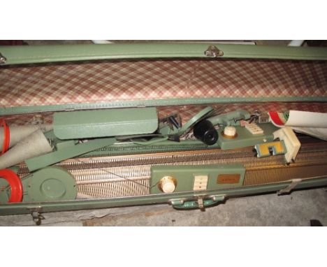 Vintage Singer knitting machine, made in France, in canvas carrying case.