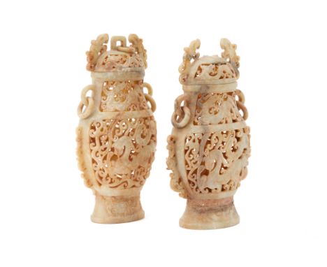 A PAIR OF CHINESE CARVED HARDSTONE VASES AND COVERS
With pierced decoration and drop ring handles
Largest measures 27cm high
