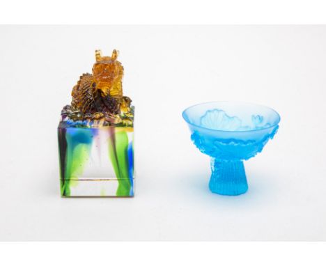 A CRYSTAL GLASS DRAGON SEAL AND A STEM CUP
A dragon seal, with another blue crystal stem cup, marked underneath undistinguish