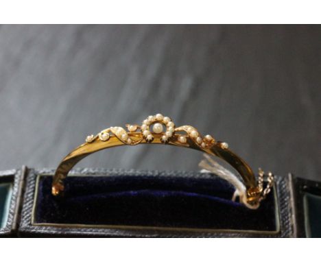 Cased ladies gold & pearl bangle
