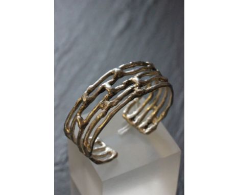 Silver bangle of organic form in a Watling of Lacock box