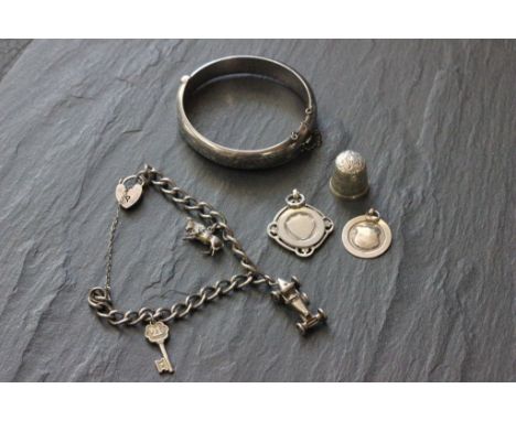Mixed silver items to include; charm bracelet, thimble, fob and bangle