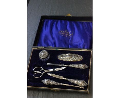 A cased silver mounted manicure set, Birmingham 1913, Gibson & Co