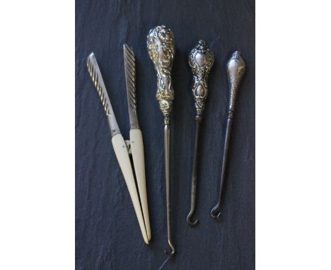 A pair of late Victorian silver and ivory glove stretchers, London 1888, Harrison Brothers, along with button hooks each with