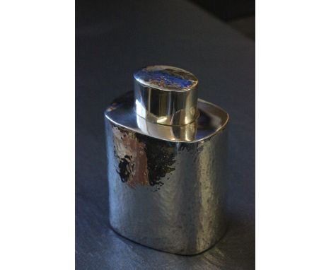 A silver tea caddy with hammered finish, Birmingham 1928