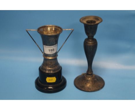 A SMALL HALLMARKED SILVER TROPHY AND A HALLMARKED SILVER CANDLE HOLDER  (2)