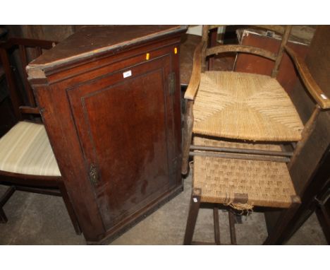A HANGING CORNER CUPBOARD TOGETHER WITH A WOVEN CHAIR AND MATCHING STOOL