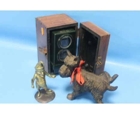 A NOVELTY SCOTTIE DOG MONEY BANK TOGETHER WITH A GHOST SKYMASTER PIGEON CLOCK AND A BRASS ORNAMENT  (3)