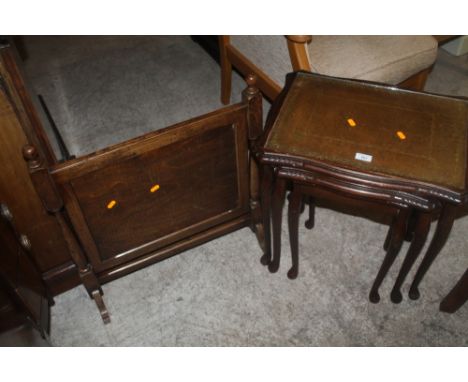 A GLASS TOPPED NEST OF TABLES AND A FIRESCREEN  (2)