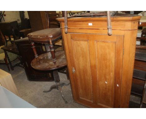 A OAK TILT TOP TRIPOD TABLE TOGETHER WITH TWO CORNER CABINETS