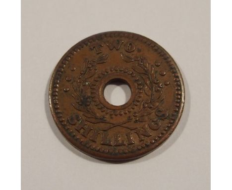 A rare Australian two shilling Internment camp token OBV centre hole with beads and wreath 'Two Shillings' REV centre hold wi