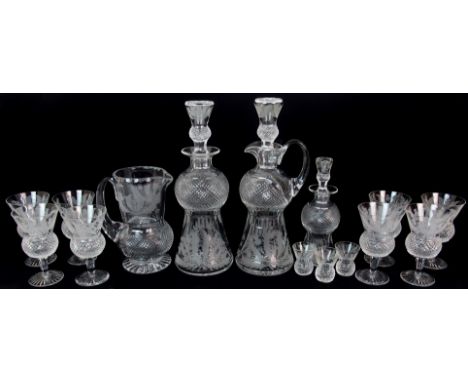 A suite of Edinburgh Crystal "Thistle" pattern beverage set comprising eight wine stems, ewer, decanter, three tot cups and a