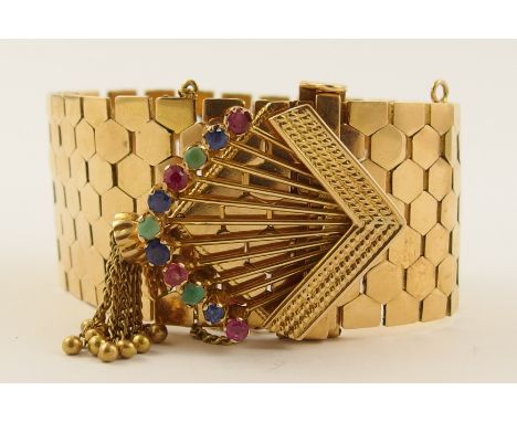 An 18ct bracelet  with honey comb shaped links, the chevron clasp is set with turquoise, ruby and sapphires, with a tassel te