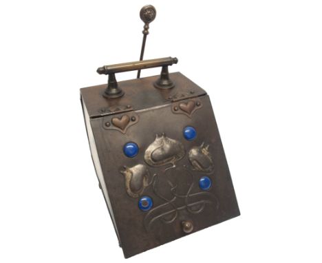 An Arts and Crafts copper embossed coal depot with honesty plants flanked by enamel medallions, 37cm high