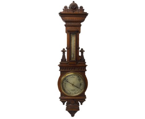 A Gardners & Co. oak cased barometer and thermometer the architectural case carved with finials, 104cm high