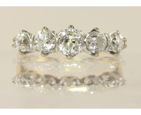 An 18ct gold five stone diamond ring of approx 1.85cts combined, the diamonds are all claw set in white gold crown mounts to 