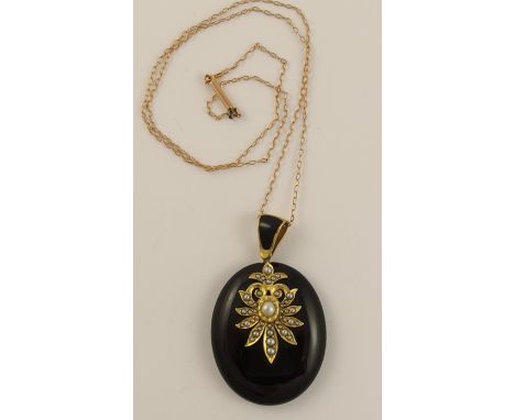 A Victorian mourning pendant in onyx black enamel and yellow metal mounts studded with split pearls, with a 9ct fine trace ch