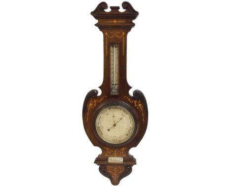 An Edwardian rosewood and inlaid scroll shaped barometer and thermometer inscribed to J Trotter, Glasgow, above a presentatio