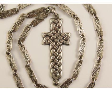 A rare Alexander Ritchie silver Celtic cross and chain the front of the cross is a deeply interlaced Celtic knotwork motif wi