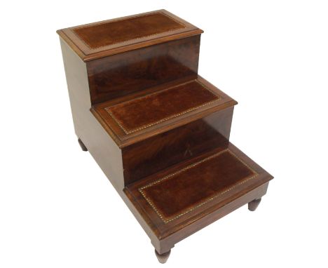 A Victorian mahogany library step with hinged top step above two steps, each inset with plush material and on turned feet, 61
