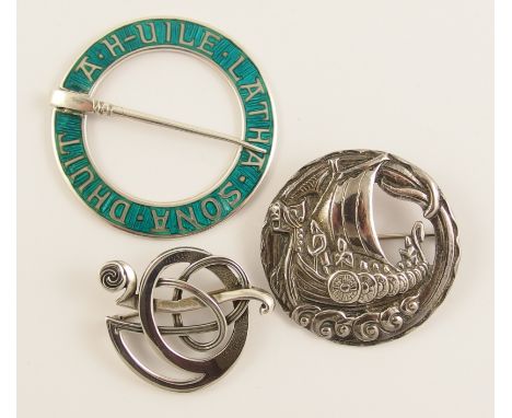 Three Scottish brooches a silver and turquoise green enamel annular brooch designed by Alexander Ritchie. The brooch has an i