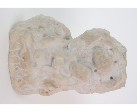 A Chinese marble boulder carving depicting three figures seated beneath a pine tree, signed to the reverse, 14.5cm high