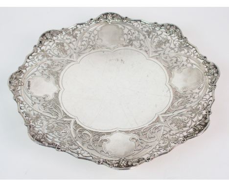 A silver fruit dish by Harrison Brothers & Howson (George Howson), Sheffield 1936, of scalloped circular form with pierced fo