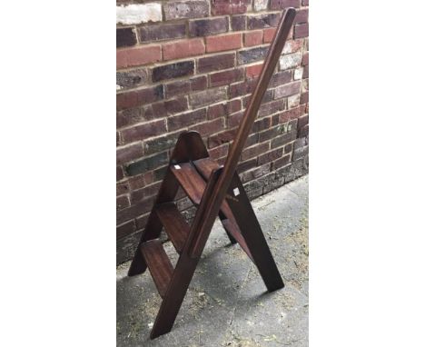 A pair of mahogany folding library steps with long handrail, three rungs either side, 123cm to top of hand rail 