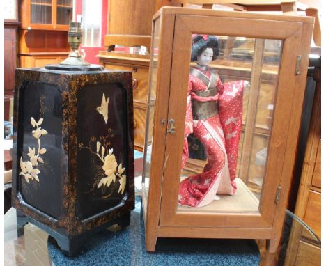 A Japanese Geisha Girl standing doll in separate glazed walnut cabinet, 52cm high, together with a Japanese lacquer and mothe