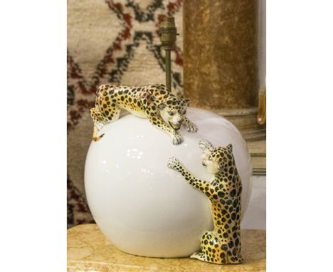 LAMPS, white ceramic, spherical, modelled with two playing leopards, together with a smaller similar lamp, largest 42cm H x 3