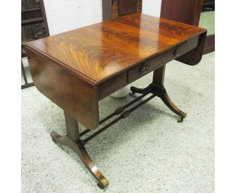 SOFA TABLE, Regency style mahogany with drop flap top and a single drawer below on short swept feet with cappings and castors