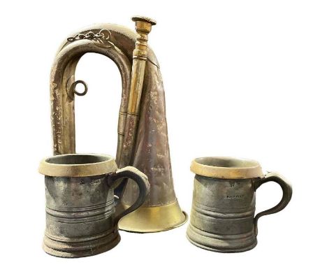 An old brass and copper bugle by Henry Keat, London together with two 19th Century pewter half pint measures with brass rims 