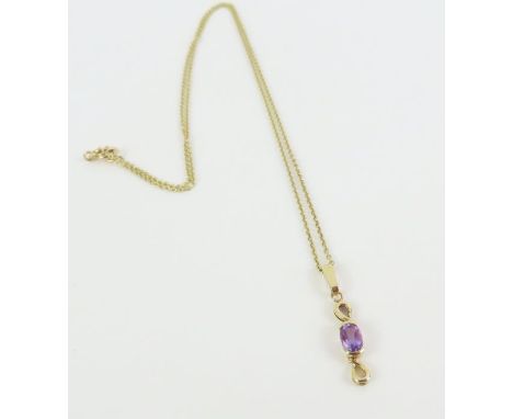 A 9ct gold trace chain, 44cm long, together with an amethyst pendant (tests as 9ct gold), 2.2g gross, cased