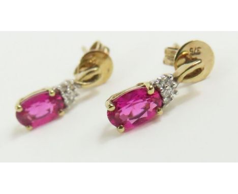 A pair of ruby and diamond stud earrings, marked '375', 1.2g gross, cased ***please note the change to the description of thi