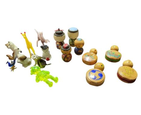 A quantity of small Japanese painted wood Kokeshi dolls together with some small glass and ceramic animals