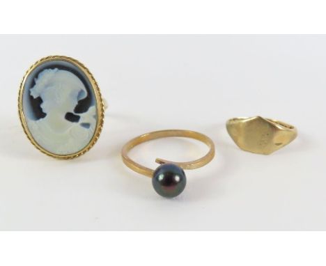 A 9ct gold black and white cameo ring, finger size P 1/2, a 9ct gold signet ring I 1/2, and a 9ct gold ring set with a single