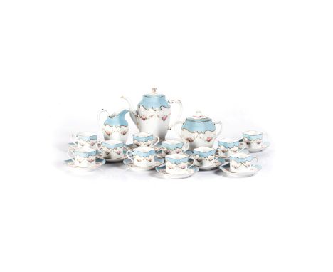 A LIMOGES QUATREFOIL SCALLOPPED COFFEE SERVICE MANUFACTURED BY W. GUERIN, 1891-1932 decorated with swags of pink roses below 