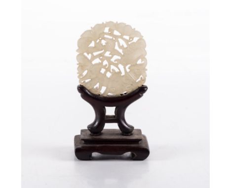 A CHINESE CELADON JADE ‘LINGZHI AND BAT’ PLAQUE, LATE 19TH/EARLY 20TH CENTURY the oval plaque pierced and carved with a lingz