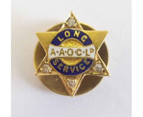 An 18ct gold long service tie stud for the Anglo-American Oil Co set with diamonds to four points of the six pointed star, en