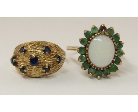 A 9ct blue gem stone set dome ring and a 9ct emerald and opal ring