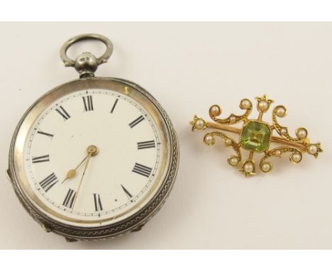 A 15ct peridot and pearl Edwardian brooch and a silver pocket watch