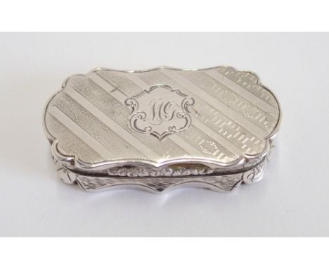 A Victorian silver vinaigrette by Alfred Taylor, Birmingham 1854, of serpentine rectangular form, with engine turned decorati