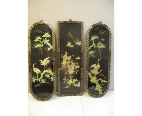 A set of three 20th century Chinese black lacquered panels set with mother of pearl, with two ladies and cranes, 91cm h x 30c